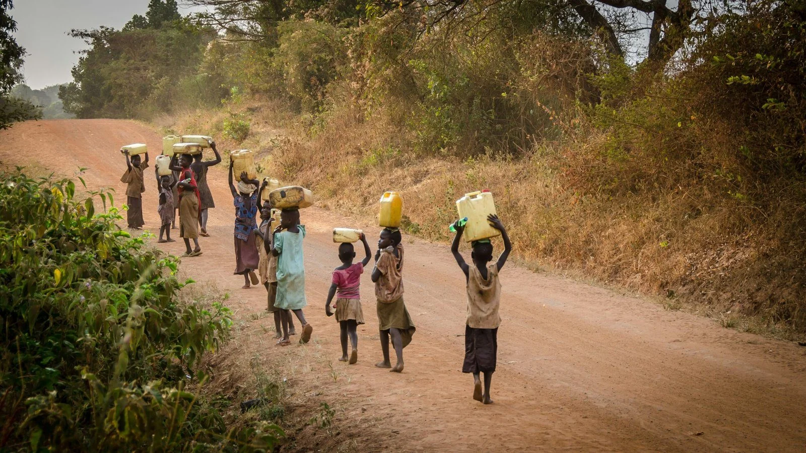 Children carrying water across the Gambia